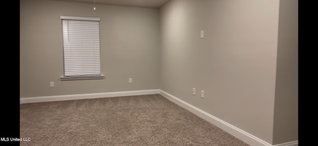 unfurnished room with carpet flooring