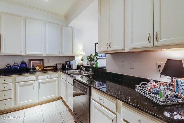 kitchen featuring black dishwasher, white cabinets, a sink, and dark stone countertops