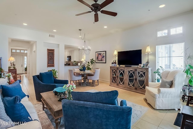 living room with ornamental molding, light tile patterned flooring, visible vents, and recessed lighting