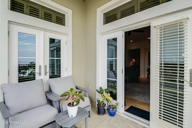 entrance to property featuring french doors and stucco siding