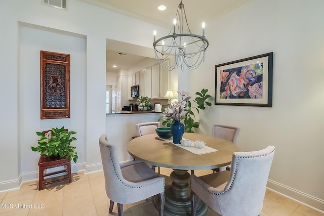 dining space with baseboards, visible vents, a notable chandelier, and light tile patterned flooring