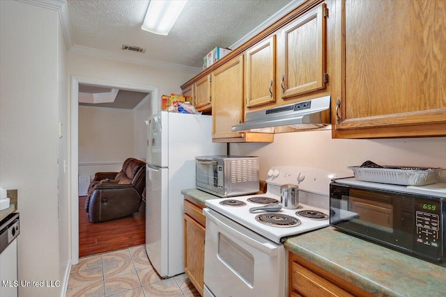 2120 Meagan Dr, Byram, MS 39272 - kitchen featuring white appliances, under cabinet range hood, ornamental molding, a textured ceiling, and light countertops
