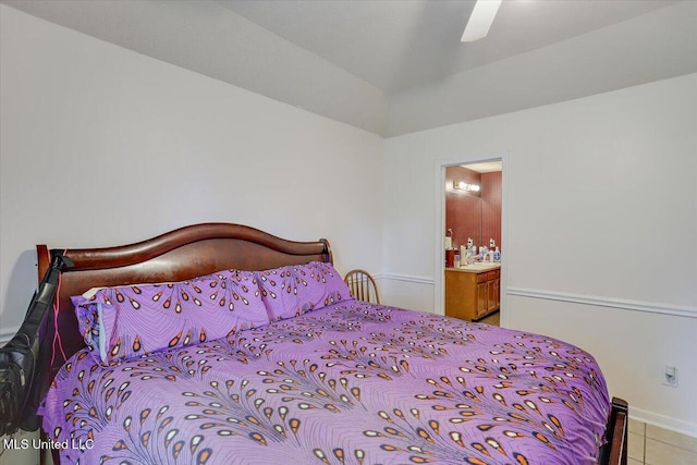 2120 Meagan Dr, Byram, MS 39272 - bedroom featuring light tile patterned floors, ensuite bath, and a ceiling fan