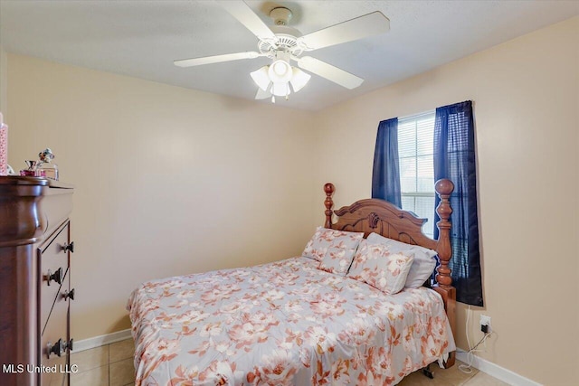 2120 Meagan Dr, Byram, MS 39272 - bedroom with light tile patterned floors and a ceiling fan