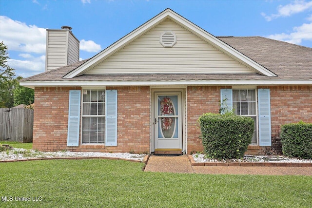2120 Meagan Dr, Byram, MS 39272 - view of front of property with brick siding, roof with shingles, and a chimney