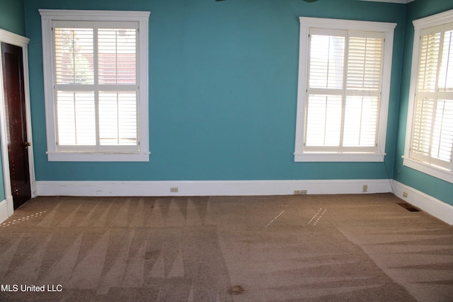 245 E College Ave, Holly Springs, MS 38635 - carpeted empty room with baseboards