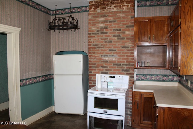 245 E College Ave, Holly Springs, MS 38635 - kitchen featuring white appliances, wallpapered walls, baseboards, brown cabinetry, and light countertops