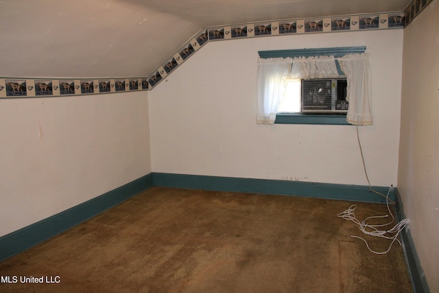 245 E College Ave, Holly Springs, MS 38635 - carpeted spare room featuring lofted ceiling and baseboards
