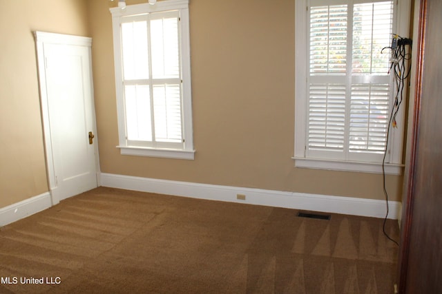 245 E College Ave, Holly Springs, MS 38635 - unfurnished room with carpet flooring and baseboards
