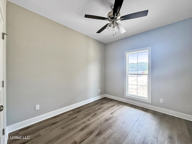 354 Willow Way, Canton, MS 39046 - empty room with dark wood-style flooring, baseboards, and ceiling fan