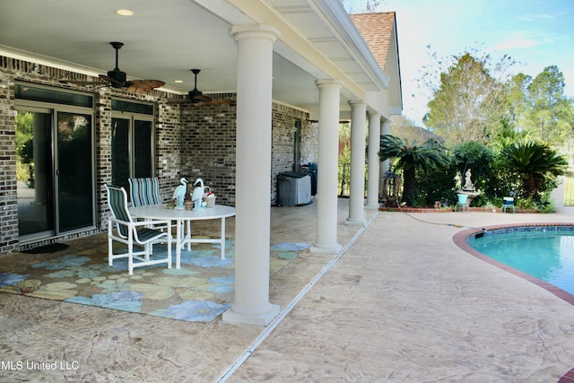 view of pool featuring ceiling fan and a patio area