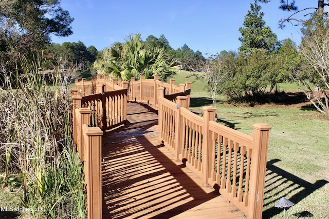 wooden deck with a yard