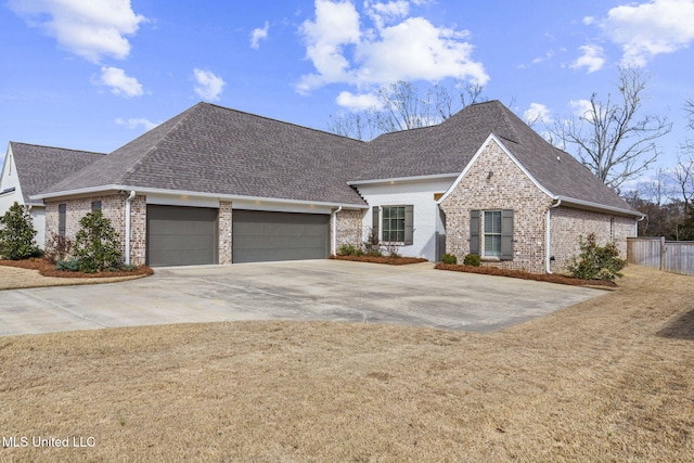 ranch-style home with a garage, a shingled roof, concrete driveway, fence, and brick siding