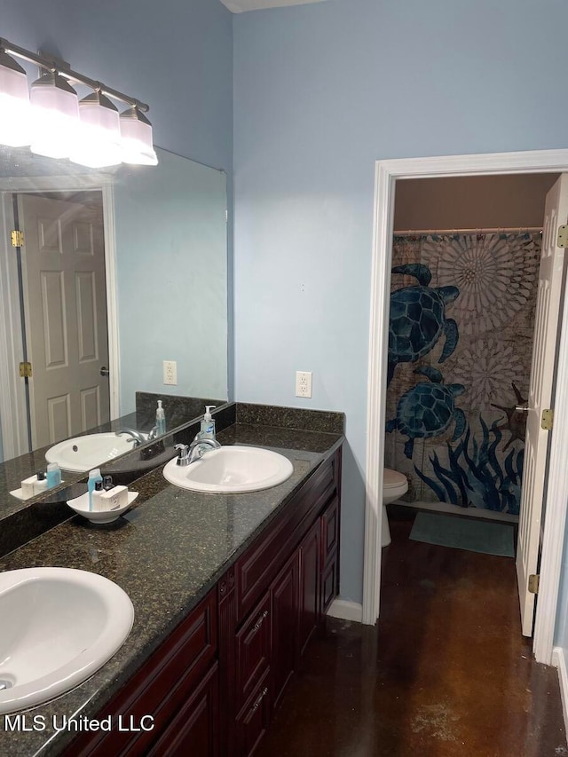 bathroom featuring vanity and toilet