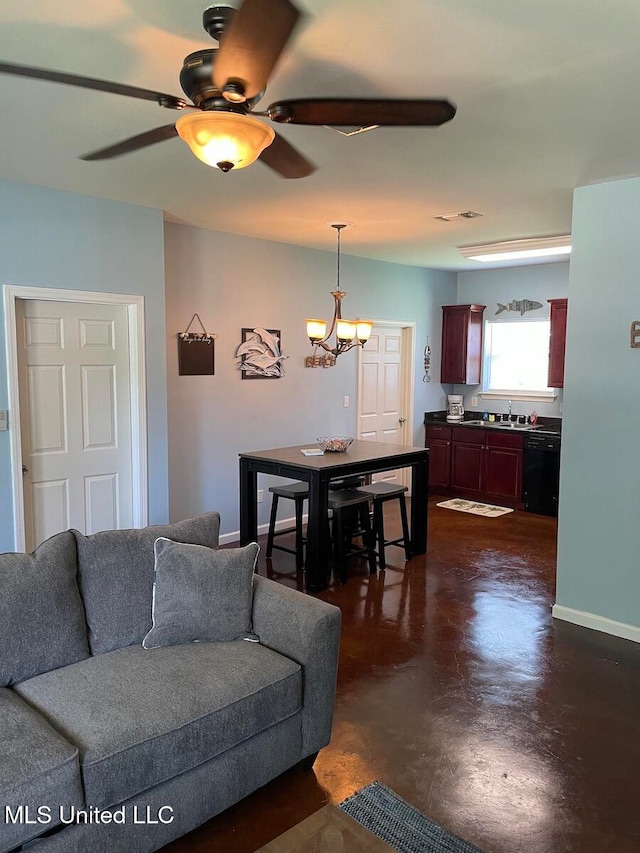 living room featuring sink and ceiling fan with notable chandelier