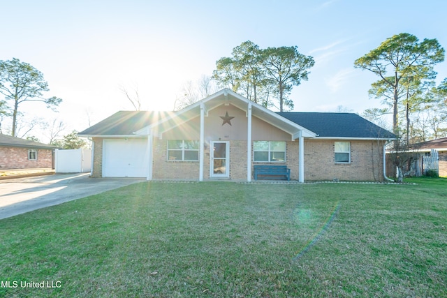 ranch-style home with an attached garage, brick siding, fence, driveway, and a front yard