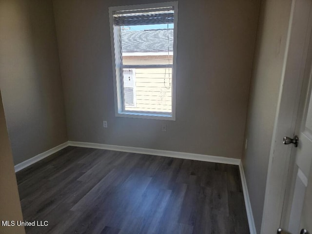 13497 Artes St, Gulfport, MS 39503 - unfurnished room featuring dark wood-style flooring and baseboards