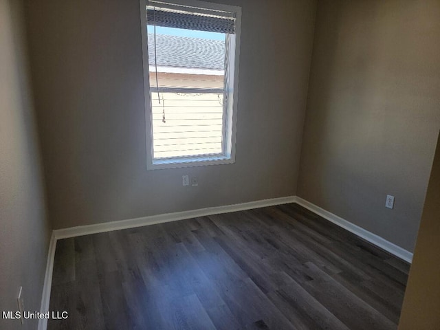 13497 Artes St, Gulfport, MS 39503 - empty room featuring dark wood finished floors and baseboards