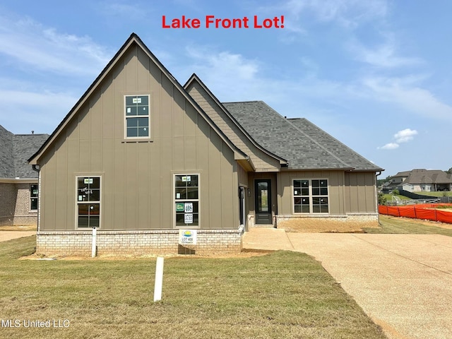 3755 Roland Dr, Southaven, MS 38672 - view of front of property featuring board and batten siding and a shingled roof