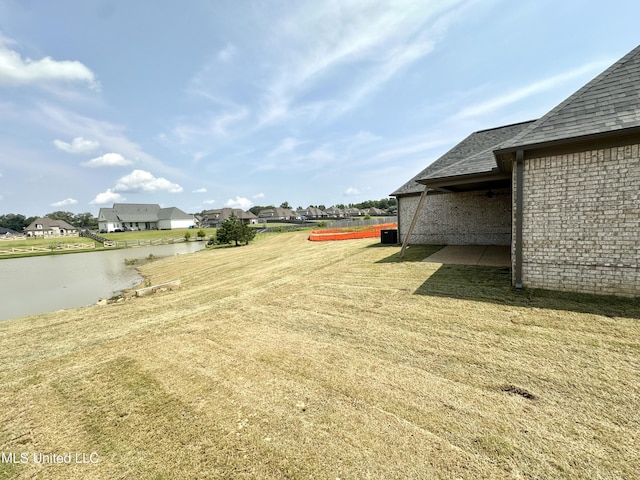 3755 Roland Dr, Southaven, MS 38672 - view of grassy yard featuring a water view and a residential view