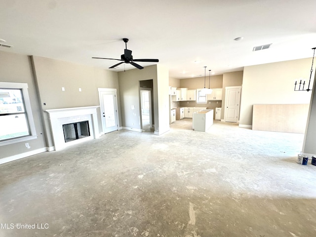3755 Roland Dr, Southaven, MS 38672 - unfurnished living room with concrete flooring, a fireplace, and a ceiling fan