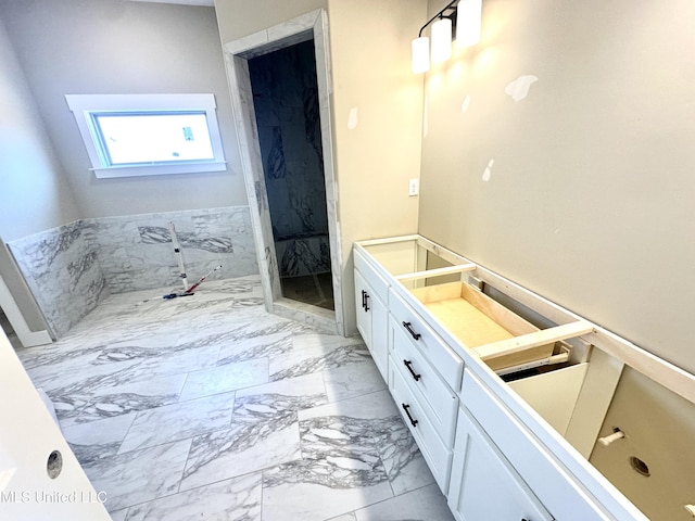 3755 Roland Dr, Southaven, MS 38672 - bathroom featuring marble finish floors and a bath