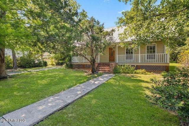 view of front of house with metal roof, a front lawn, and a porch