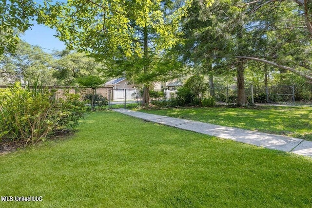 view of yard featuring a gate and fence