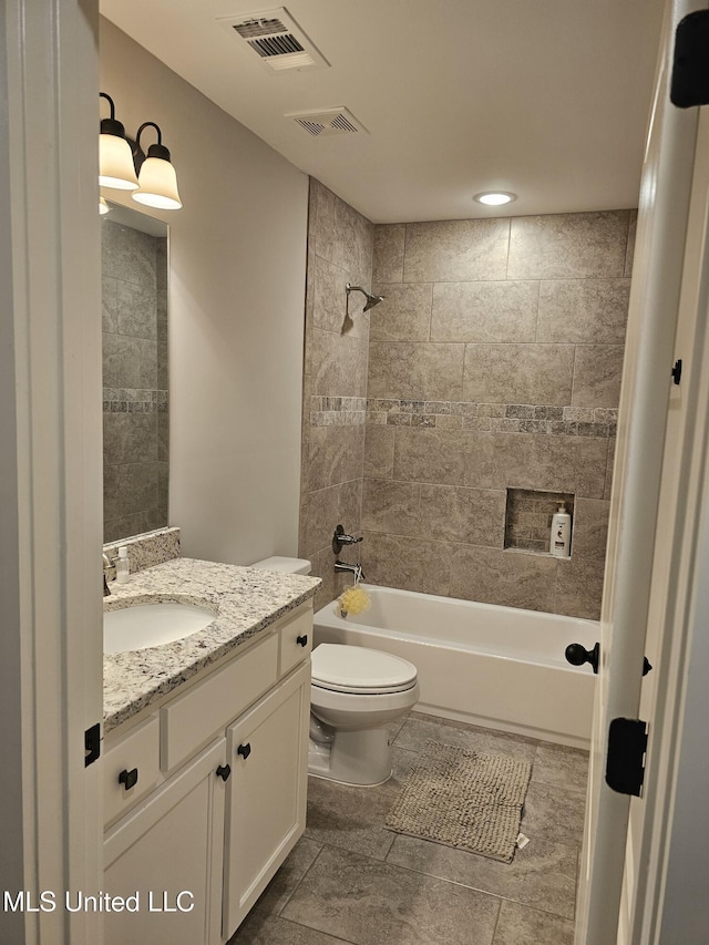 full bath with toilet, vanity, bathtub / shower combination, and visible vents