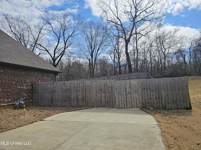 view of patio / terrace featuring fence