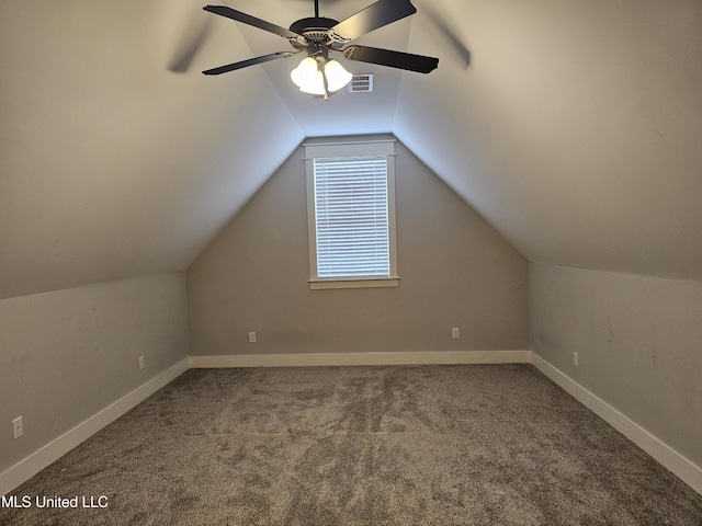 bonus room with carpet floors, visible vents, a ceiling fan, vaulted ceiling, and baseboards