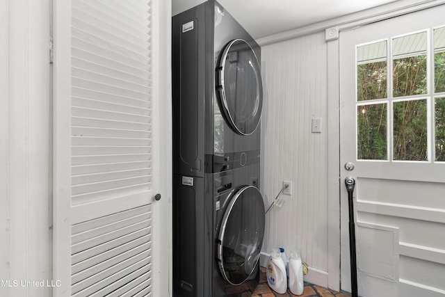 laundry area featuring stacked washer / dryer