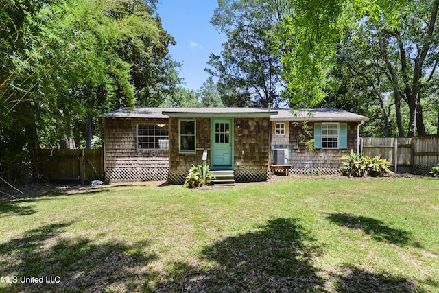 ranch-style home with a front lawn