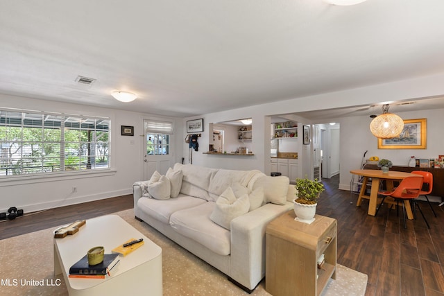 living room with dark hardwood / wood-style floors