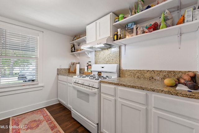 kitchen featuring light stone countertops, white cabinetry, gas range gas stove, and dark hardwood / wood-style flooring