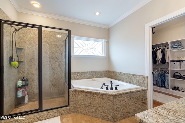6507 Shenandoah Ln, Olive Branch, MS 38654 - full bath featuring ornamental molding, a walk in closet, recessed lighting, a bath, and a stall shower