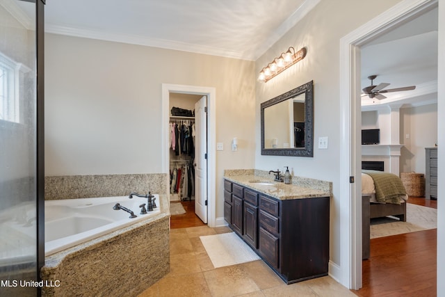 6507 Shenandoah Ln, Olive Branch, MS 38654 - full bath featuring vanity, ornamental molding, a fireplace, ceiling fan, and a spacious closet