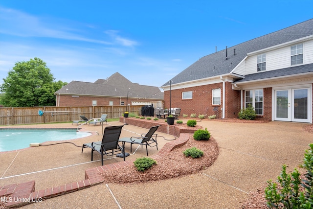 6507 Shenandoah Ln, Olive Branch, MS 38654 - view of swimming pool with a patio, a fenced backyard, french doors, and a fenced in pool