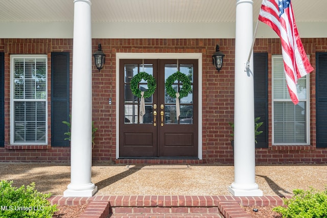 6507 Shenandoah Ln, Olive Branch, MS 38654 - entrance to property featuring french doors, a porch, and brick siding