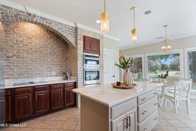 6507 Shenandoah Ln, Olive Branch, MS 38654 - kitchen featuring light tile patterned flooring, a chandelier, pendant lighting, and double oven