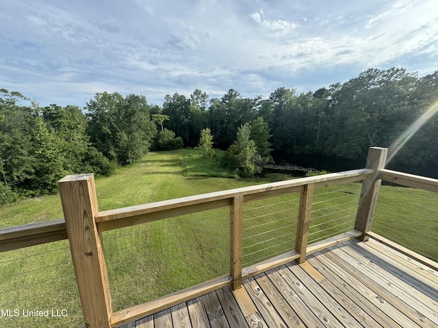 deck featuring a yard