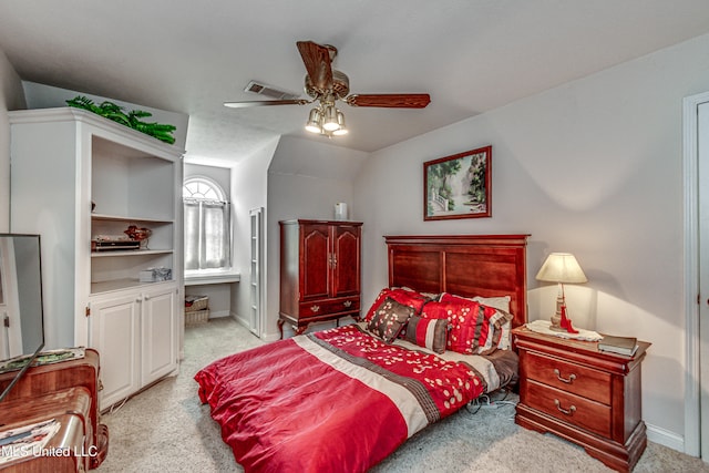 bedroom featuring light colored carpet, lofted ceiling, and ceiling fan