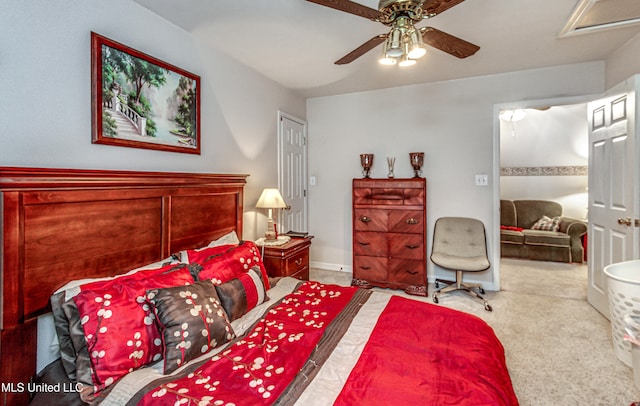 bedroom featuring ceiling fan and carpet