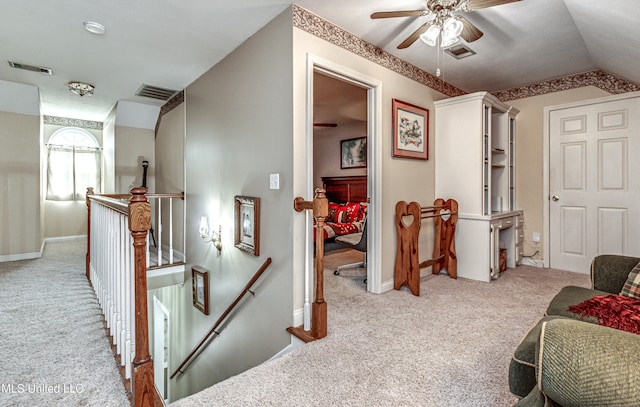 interior space with light colored carpet and lofted ceiling