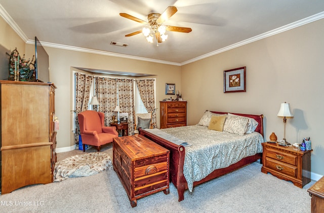 bedroom with light colored carpet, ceiling fan, and crown molding