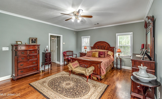 bedroom featuring ornamental molding, dark wood-type flooring, and ceiling fan