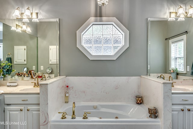 bathroom featuring vanity and a relaxing tiled tub