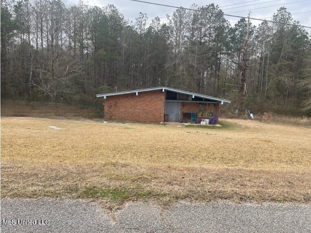 view of home's exterior with a lawn