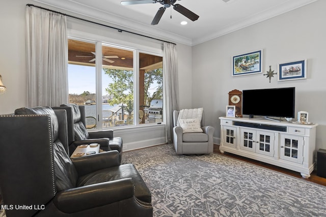 living room featuring a ceiling fan, baseboards, dark wood finished floors, and crown molding