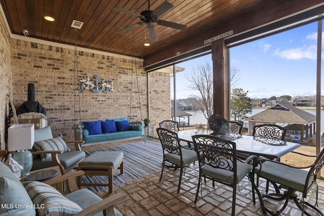 exterior space with wooden ceiling, visible vents, and ceiling fan